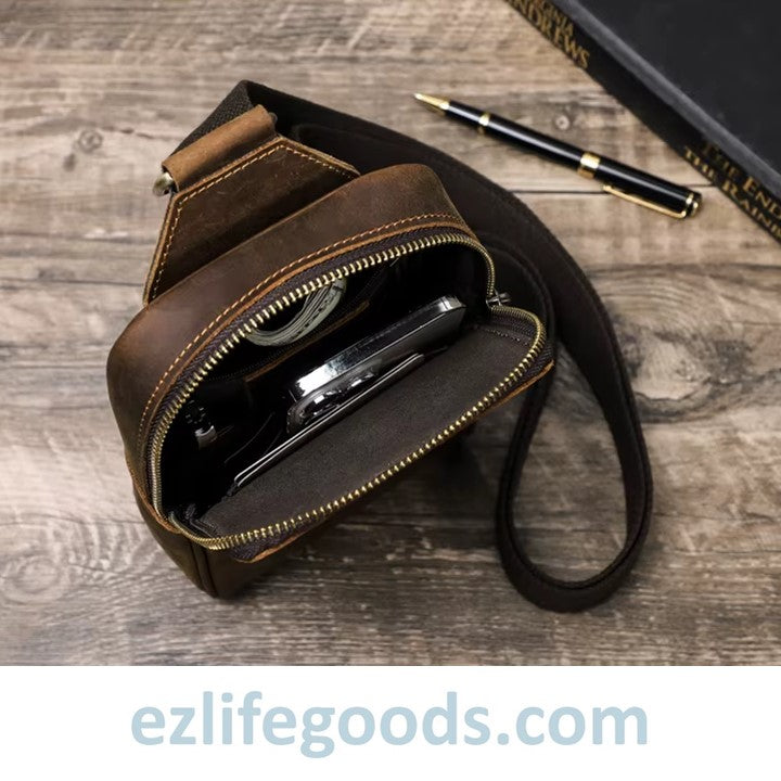 EZLIFEGOODS  inside details of a brown leather crossbody bag on a wooden surface.