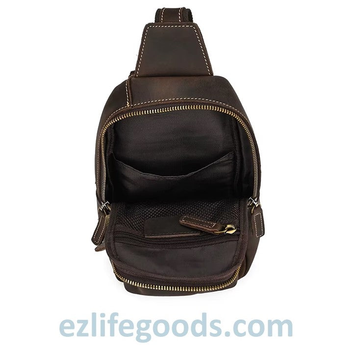 EZLIFEGOODS-Brown leather sling bag with gold zipper showing inside details and pockets.