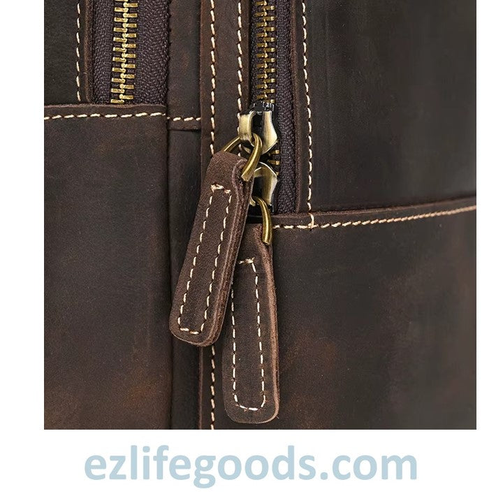 EZLIFEGOODS--Close-up of a brown leather bag with a gold zipper, featuring 'ezlifegoods.com' branding.